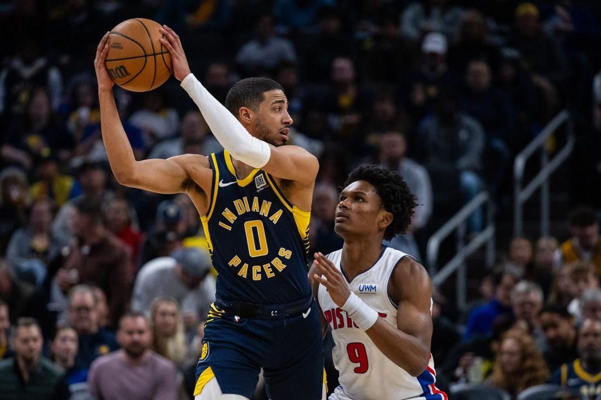 Feb 22, 2024; Indianapolis, Indiana, USA; Indiana Pacers guard Tyrese Haliburton (0) holds the ball while Detroit Pistons forward Ausar Thompson (9) defends in the first half at Gainbridge Fieldhouse.