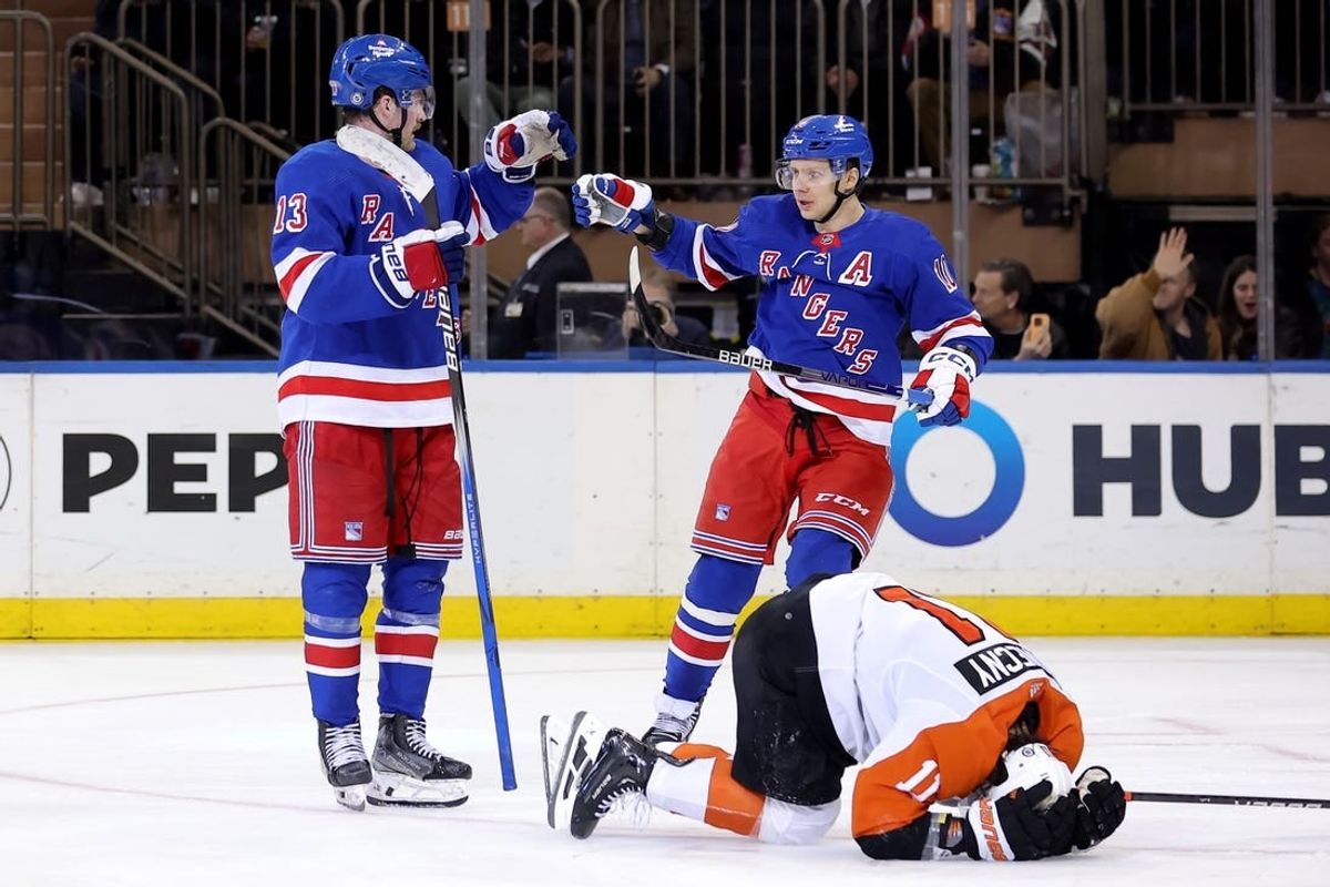 Mar 26, 2024; New York, New York, USA; New York Rangers left wing Alexis Lafreniere (13) celebrates his goal with left wing Artemi Panarin (10) in front of Philadelphia Flyers right wing Travis Konecny (11) during the third period at Madison Square Garden.