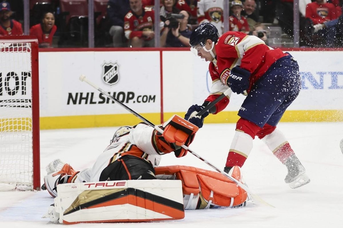 Jan 15, 2024; Sunrise, Florida, USA; Florida Panthers center Evan Rodrigues (17) shoots as Anaheim Ducks goaltender John Gibson (36) makes a save during the second period at Amerant Bank Arena.