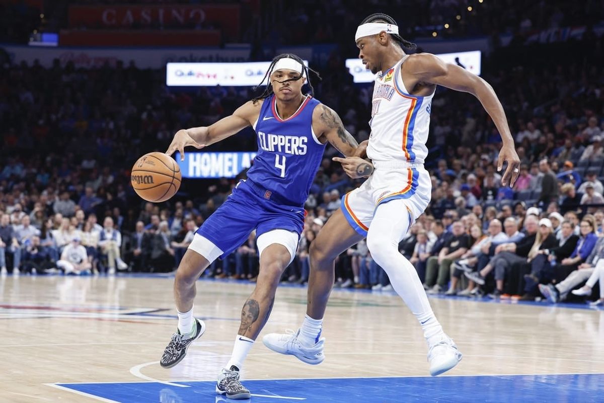 Feb 22, 2024; Oklahoma City, Oklahoma, USA; Oklahoma City Thunder guard Shai Gilgeous-Alexander (2) defends a drive by LA Clippers guard Brandon Boston Jr. (4) during the second half at Paycom Center.
