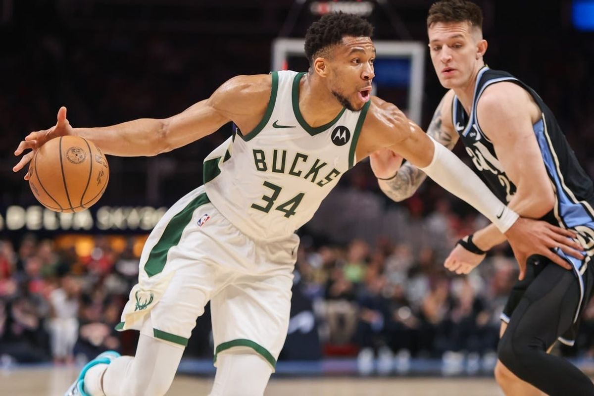 Mar 30, 2024; Atlanta, Georgia, USA; Milwaukee Bucks forward Giannis Antetokounmpo (34) drives on Atlanta Hawks guard Vit Krejci (27) in the second quarter at State Farm Arena.