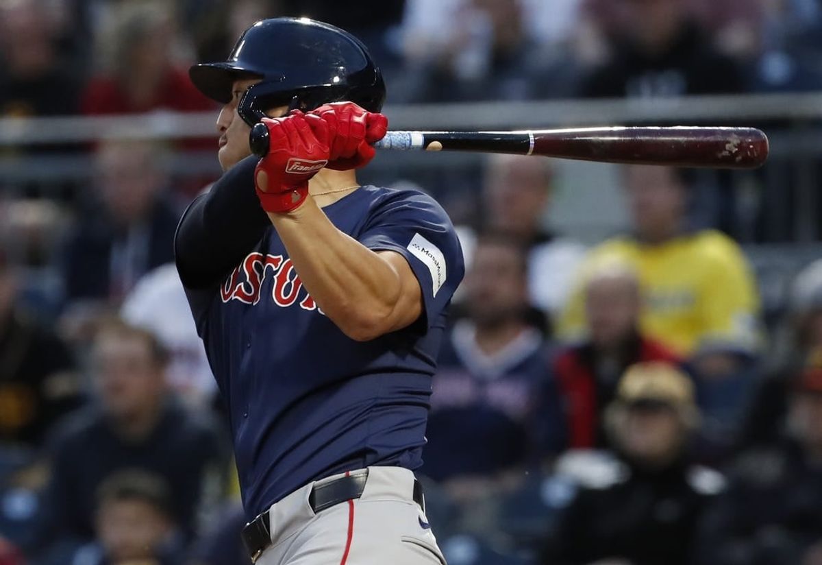 Apr 19, 2024; Pittsburgh, Pennsylvania, USA;  Boston Red Sox right fielder Rob Refsnyder (30) hits a two-run home run against the Pittsburgh Pirates during the fifth inning at PNC Park.