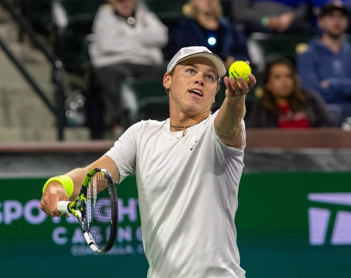 Alex Michelsen readies a serve to Tommy Paul during round two of the BNP Paribas Open in Indian Wells, Calif., Saturday, March 9, 2024.