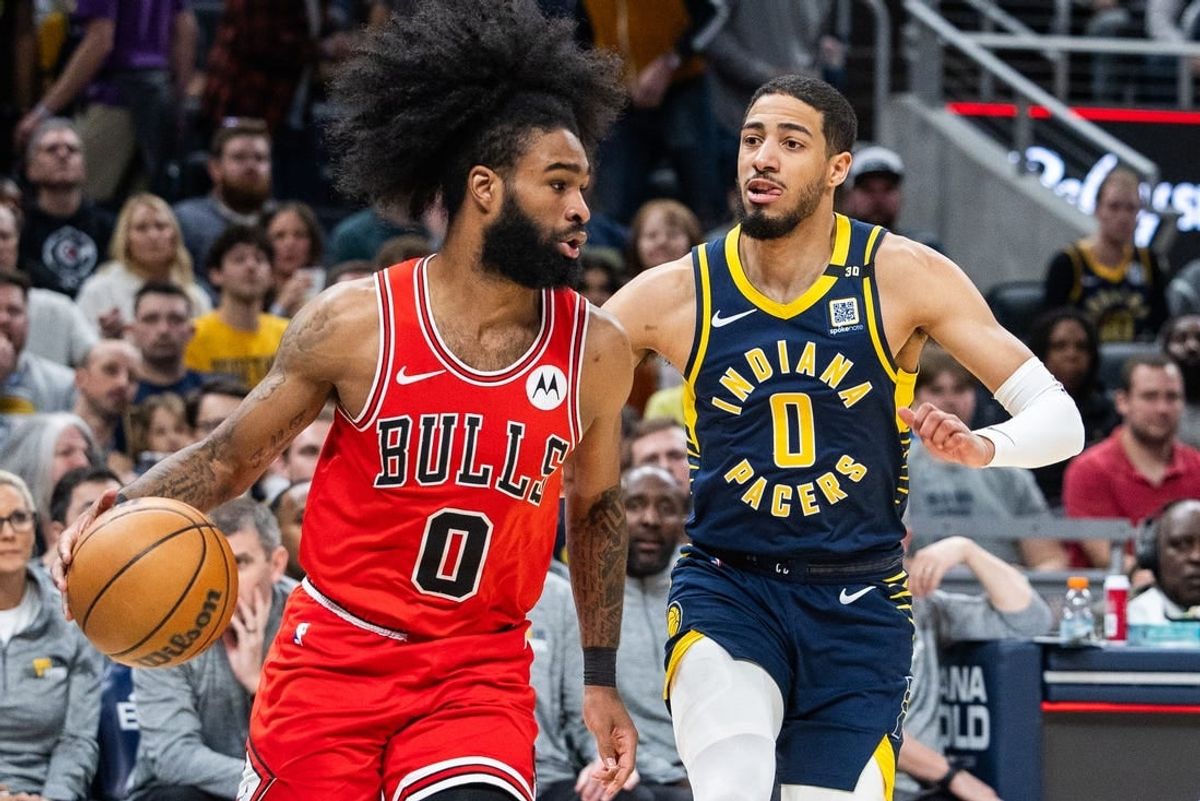 Mar 13, 2024; Indianapolis, Indiana, USA; Chicago Bulls guard Coby White (0) dribbles the ball while Indiana Pacers guard Tyrese Haliburton (0) defends in the first half at Gainbridge Fieldhouse.