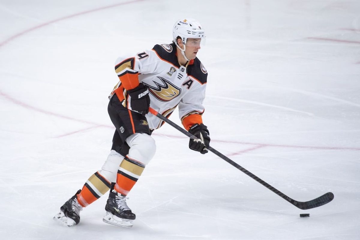 Feb 15, 2024; Ottawa, Ontario, CAN; Anaheim Ducks defenseman Cam Fowler (4) skates with the puck in the third period against the  Ottawa Senators at the Canadian Tire Centre.
