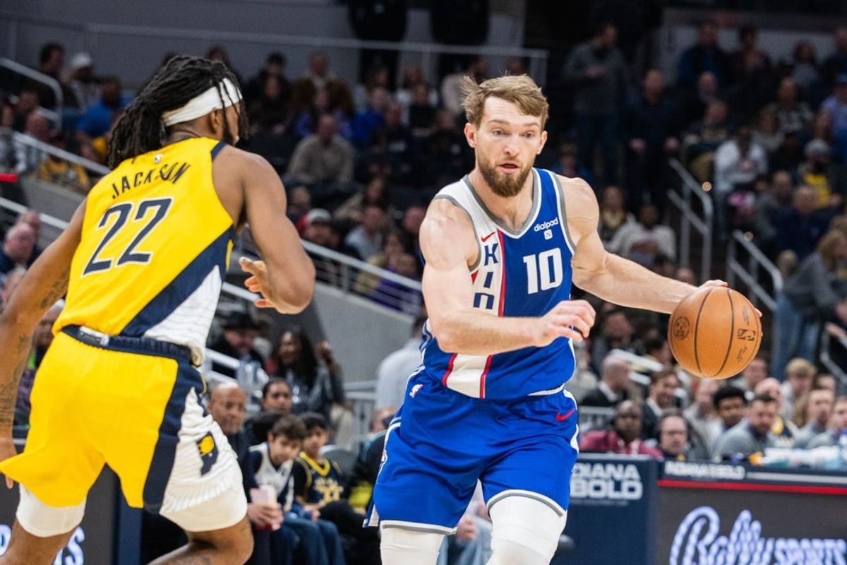 Feb 2, 2024; Indianapolis, Indiana, USA; Sacramento Kings forward Domantas Sabonis (10) dribbles the ball while Indiana Pacers forward Isaiah Jackson (22) defends in the second half at Gainbridge Fieldhouse.