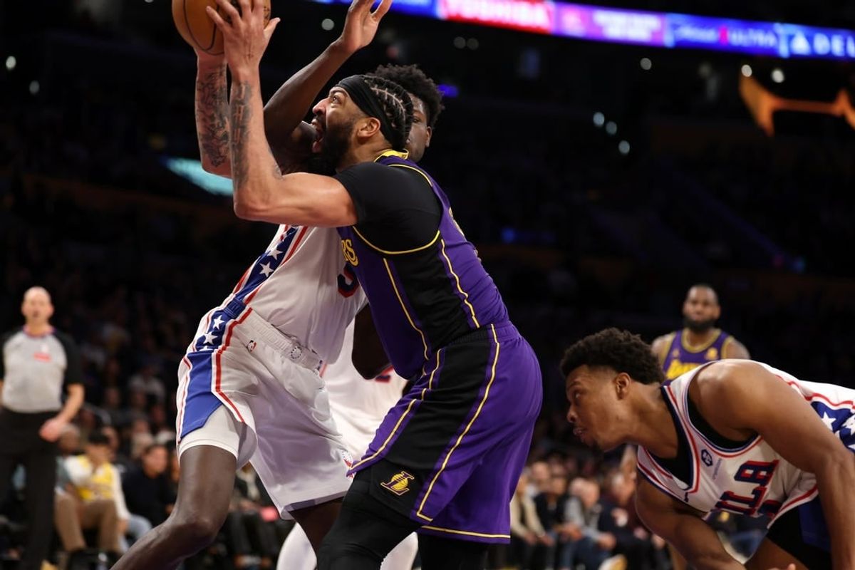 Mar 22, 2024; Los Angeles, California, USA;  Los Angeles Lakers forward Anthony Davis (3) goes to the basket against Philadelphia 76ers center Mo Bamba (5) during the fourth quarter at Crypto.com Arena.