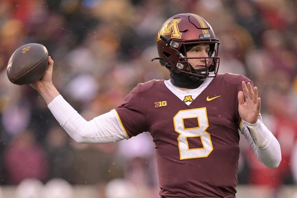 Nov 25, 2023; Minneapolis, Minnesota, USA;  Minnesota Golden Gophers quarterback Athan Kaliakmanis (8) makes a throw against the Wisconsin Badgers during the second quarter at Huntington Bank Stadium.