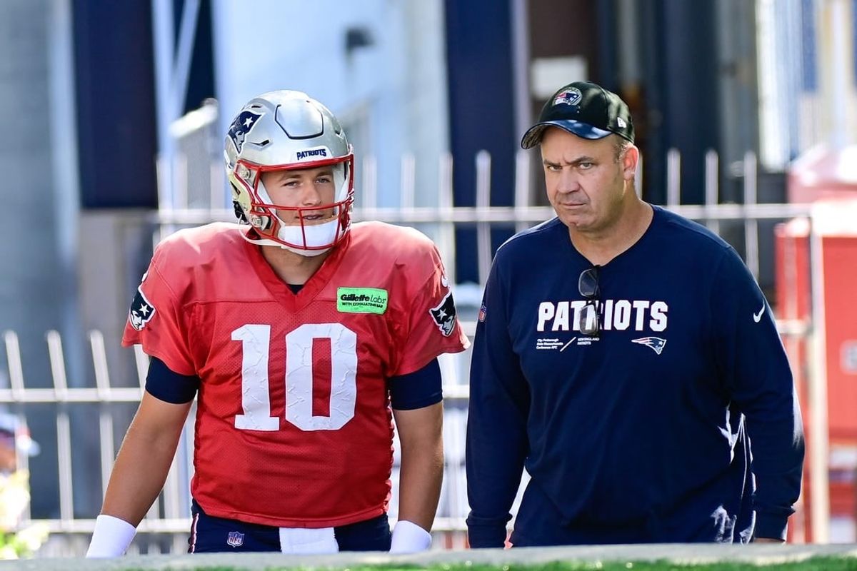 Aug 3, 2023; Foxborough, MA, USA; New England Patriots quarterback Mac Jones (10) and offensive coordinator/quarterbacks coach Bill O'Brien head to the practice fields for  training camp at Gillette Stadium.