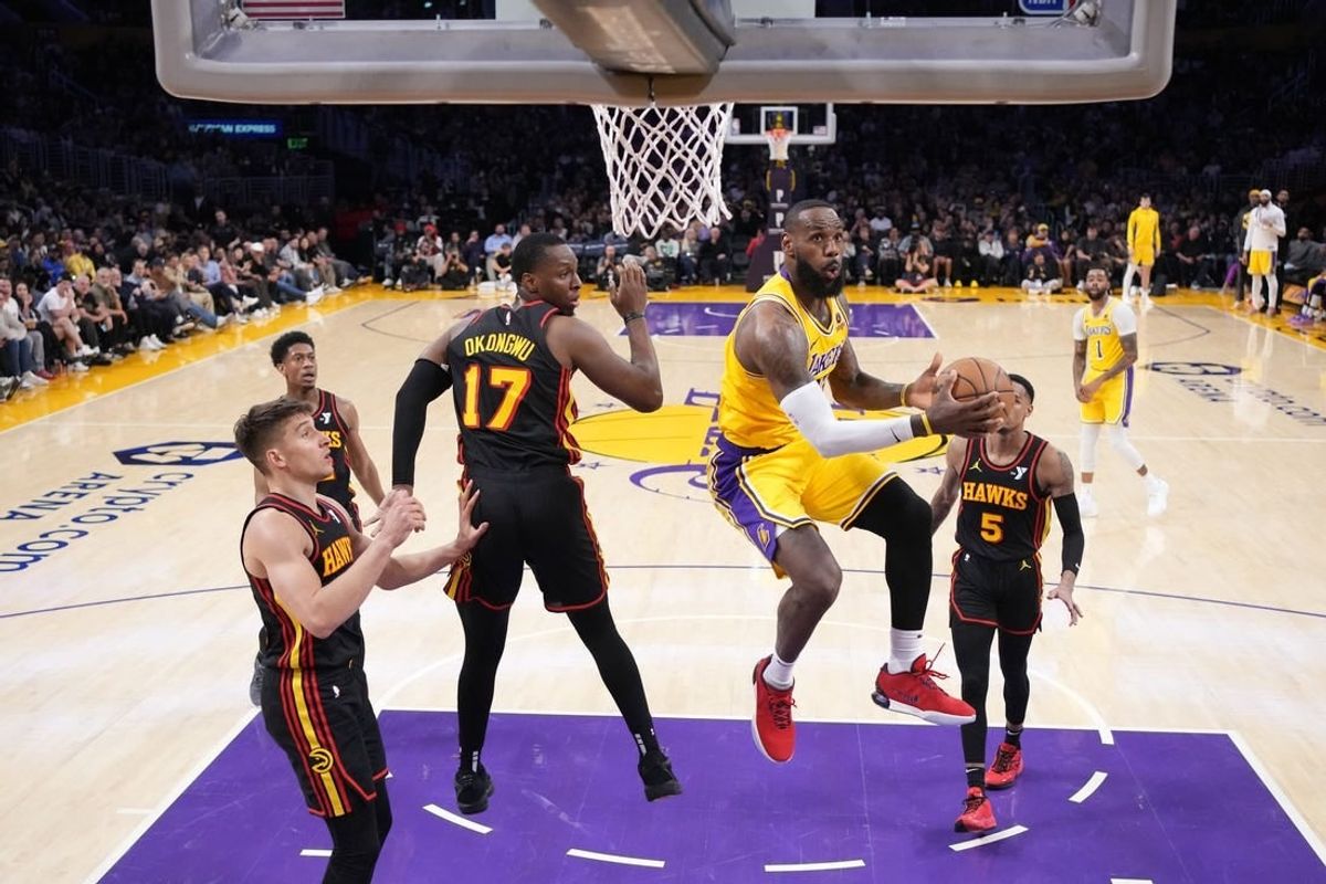 Mar 18, 2024; Los Angeles, California, USA; Los Angeles Lakers forward LeBron James (23) shoots the ball against Atlanta Hawks forward Onyeka Okongwu (17) in the second half at Crypto.com Arena.