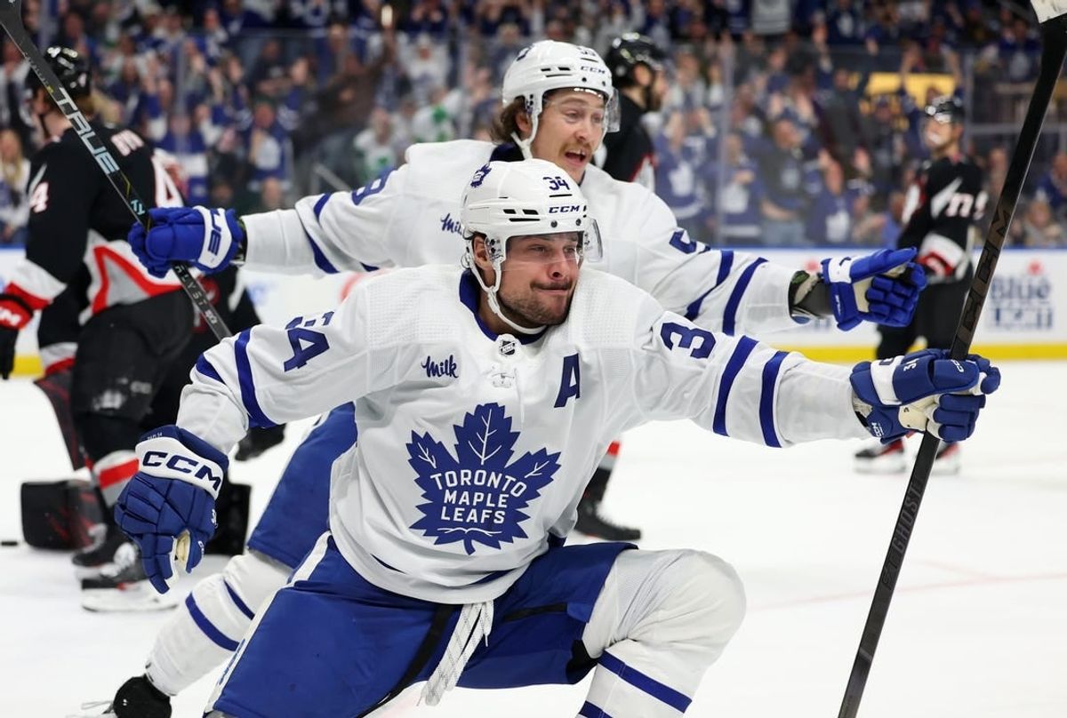 Mar 30, 2024; Buffalo, New York, USA;  Toronto Maple Leafs center Auston Matthews (34) reacts after scoring his 60th goal of the year during the third period against the Buffalo Sabres at KeyBank Center.