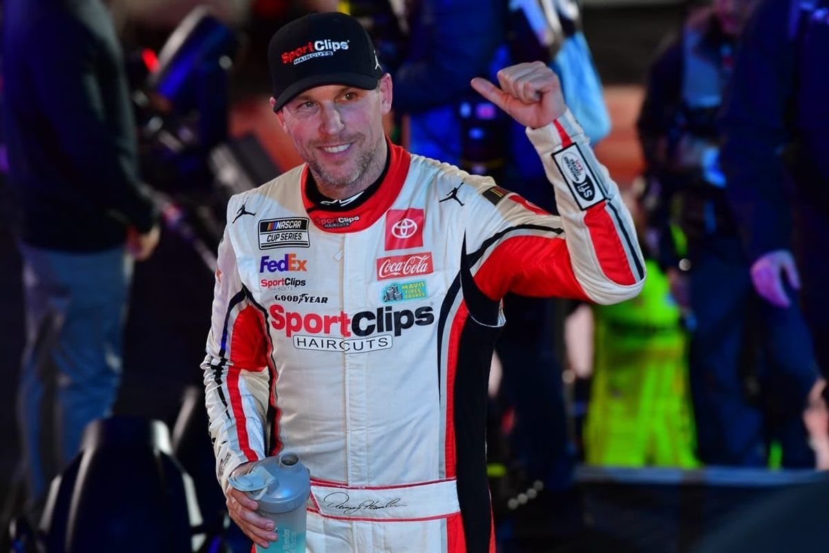 Feb 3, 2024; Los Angeles, California, USA;  NASCAR Cup Series driver Denny Hamlin (11) celebrates his victory of the Busch Light Clash at Los Angeles Memorial Coliseum.