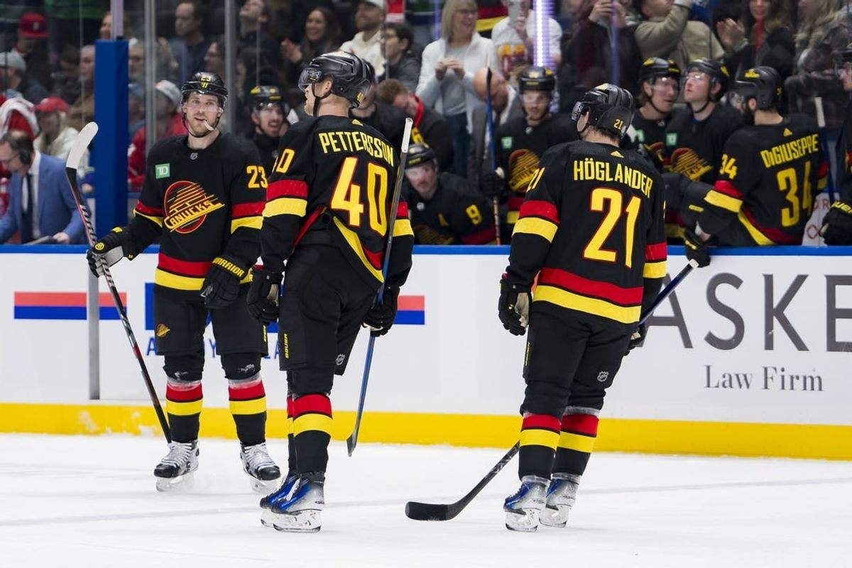 Feb 15, 2024; Vancouver, British Columbia, CAN; Vancouver Canucks forward Nils Hoglander (21) and forward Elias Pettersson (40) and celebrate Lindholm s second goal of the game against the Detroit Red Wings in the third period at Rogers Arena. Vancouver won 4-1.