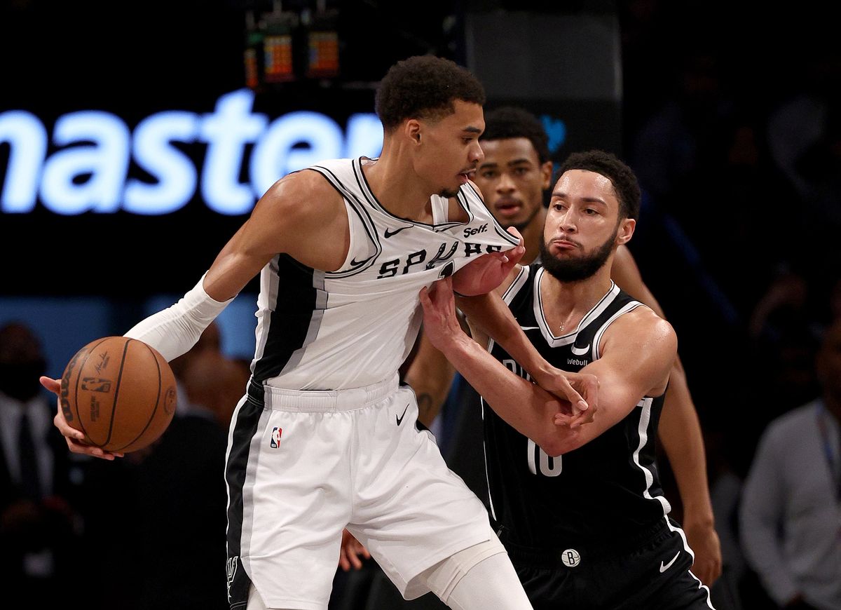 NEW YORK, NEW YORK - FEBRUARY 10: Victor Wembanyama #1 of the San Antonio Spurs heads for the net as Ben Simmons #10 of the Brooklyn Nets defends in the second half at Barclays Center on February 10, 2024 in the Brooklyn borough of New York City. The Brooklyn Nets defeated the San Antonio Spurs 123-103. NOTE TO USER: User expressly acknowledges and agrees that, by downloading and or using this photograph, User is consenting to the terms and conditions of the Getty Images License Agreement. (Photo by Elsa/Getty Images)