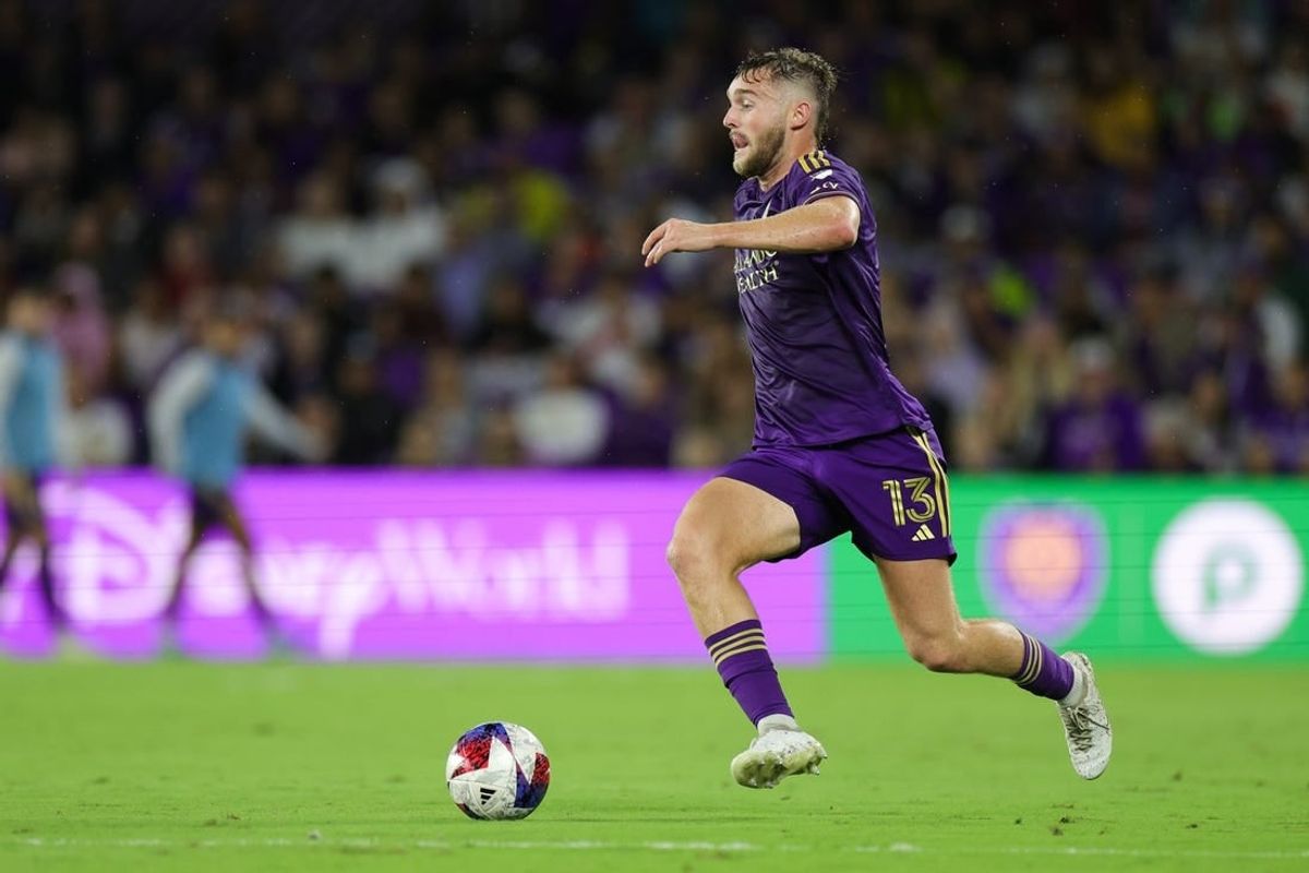 Nov 25, 2023; Orlando, Florida, USA; Orlando City forward Duncan McGuire (13) dribbles the ball against Columbus Crew during the first half in a MLS Cup Eastern Conference Semifinal match at Exploria Stadium.