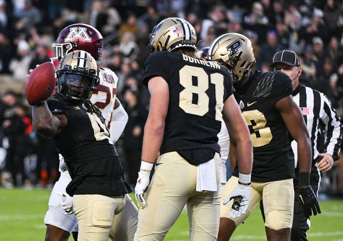 Nov 11, 2023; West Lafayette, Indiana, USA;  Purdue Boilermakers wide receiver Deion Burks (4) celebrates with tight end George Burhenn (81) and wide receiver Jaron Tibbs (13) after scoring a touchdown against the Minnesota Golden Gophers during the second half at Ross-Ade Stadium.