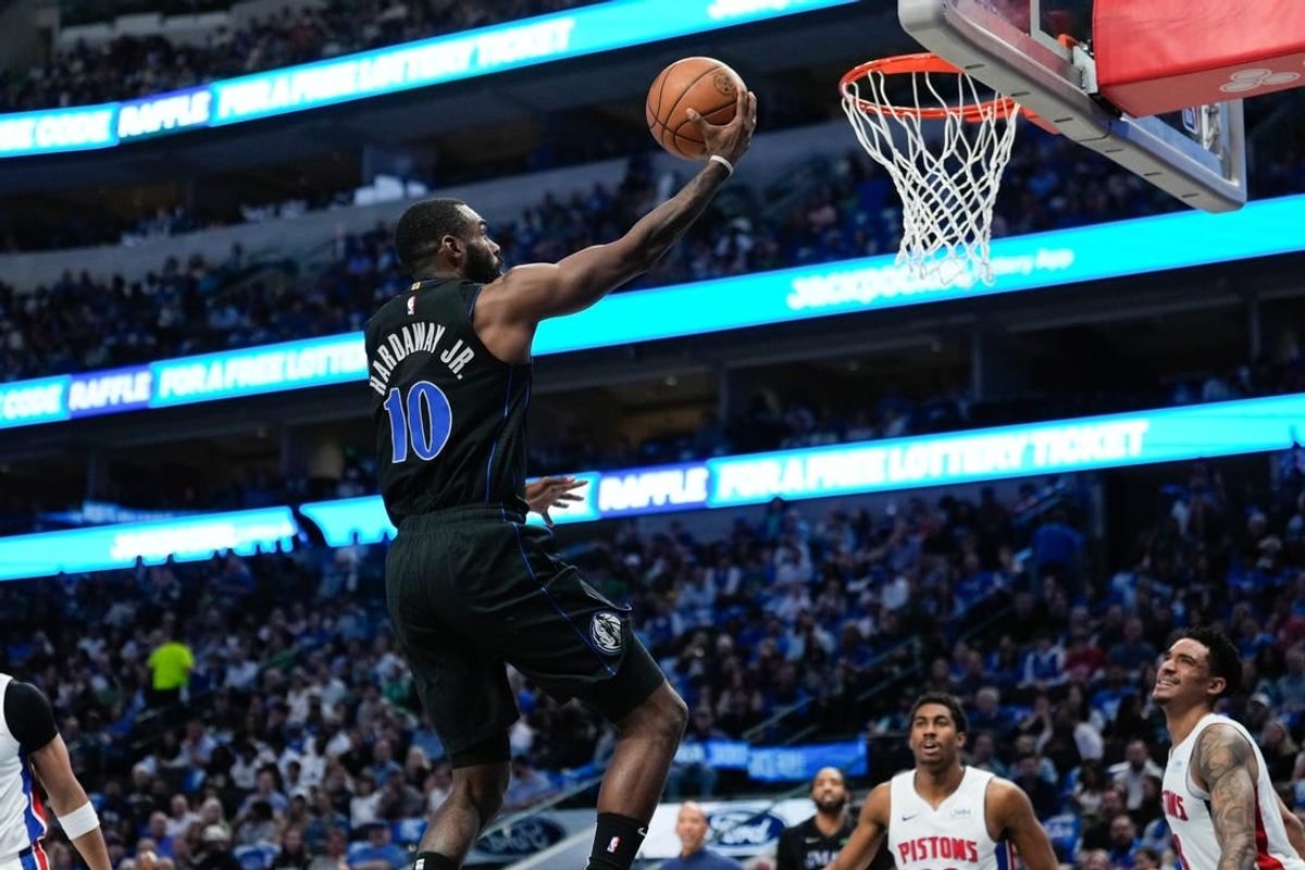 Apr 12, 2024; Dallas, Texas, USA; Dallas Mavericks forward Tim Hardaway Jr. (10) scores a layup against the Detroit Pistons during the first half at American Airlines Center.