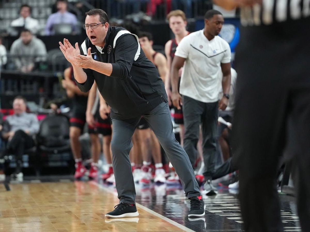Mar 8, 2023; Las Vegas, NV, USA; Stanford Cardinal head coach Jerod Haase applauds a play against the Utah Utes during the second half at T-Mobile Arena.