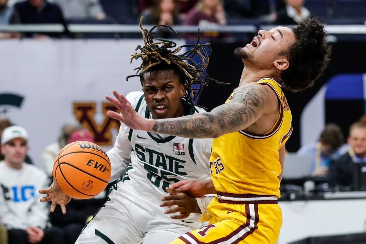 Michigan State forward Coen Carr (55) dribbles against Minnesota guard Braeden Carrington (4) during the first half of Second Round of Big Ten tournament at Target Center in Minneapolis, Minn. on Thursday, March 14, 2024.