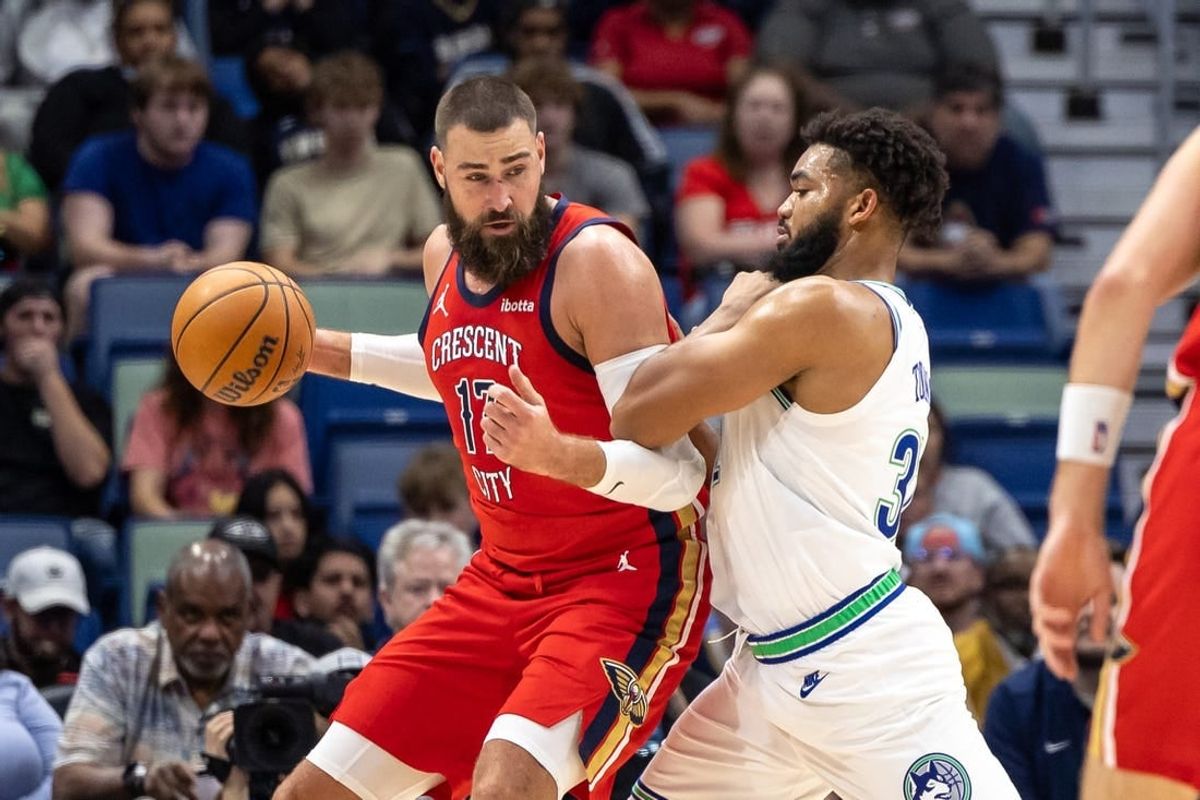 Nov 18, 2023; New Orleans, Louisiana, USA; New Orleans Pelicans center Jonas Valanciunas (17) fights for position against Minnesota Timberwolves center Karl-Anthony Towns (32) during the first half at the Smoothie King Center.