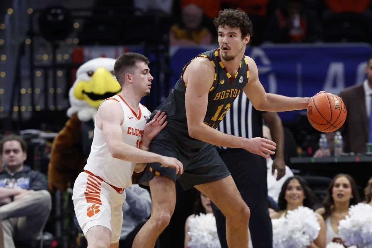 Mar 13, 2024; Washington, D.C., USA; Boston College Eagles forward Quinten Post (12) dribbles the ball as Clemson Tigers guard Joseph Girard III (11) defends in the second half at Capital One Arena.