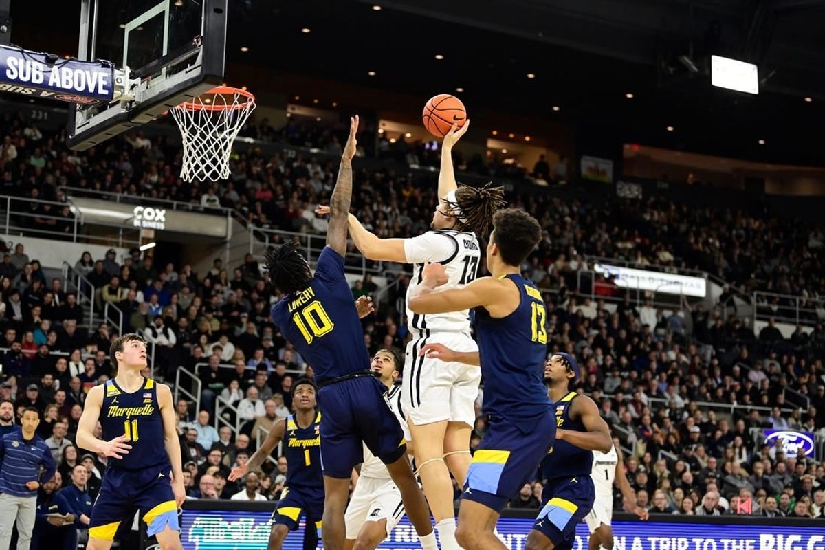 Dec 19, 2023; Providence, Rhode Island, USA; Providence Friars forward Josh Oduro (13) shoots during the first half against the Marquette Golden Eagles at Amica Mutual Pavilion.