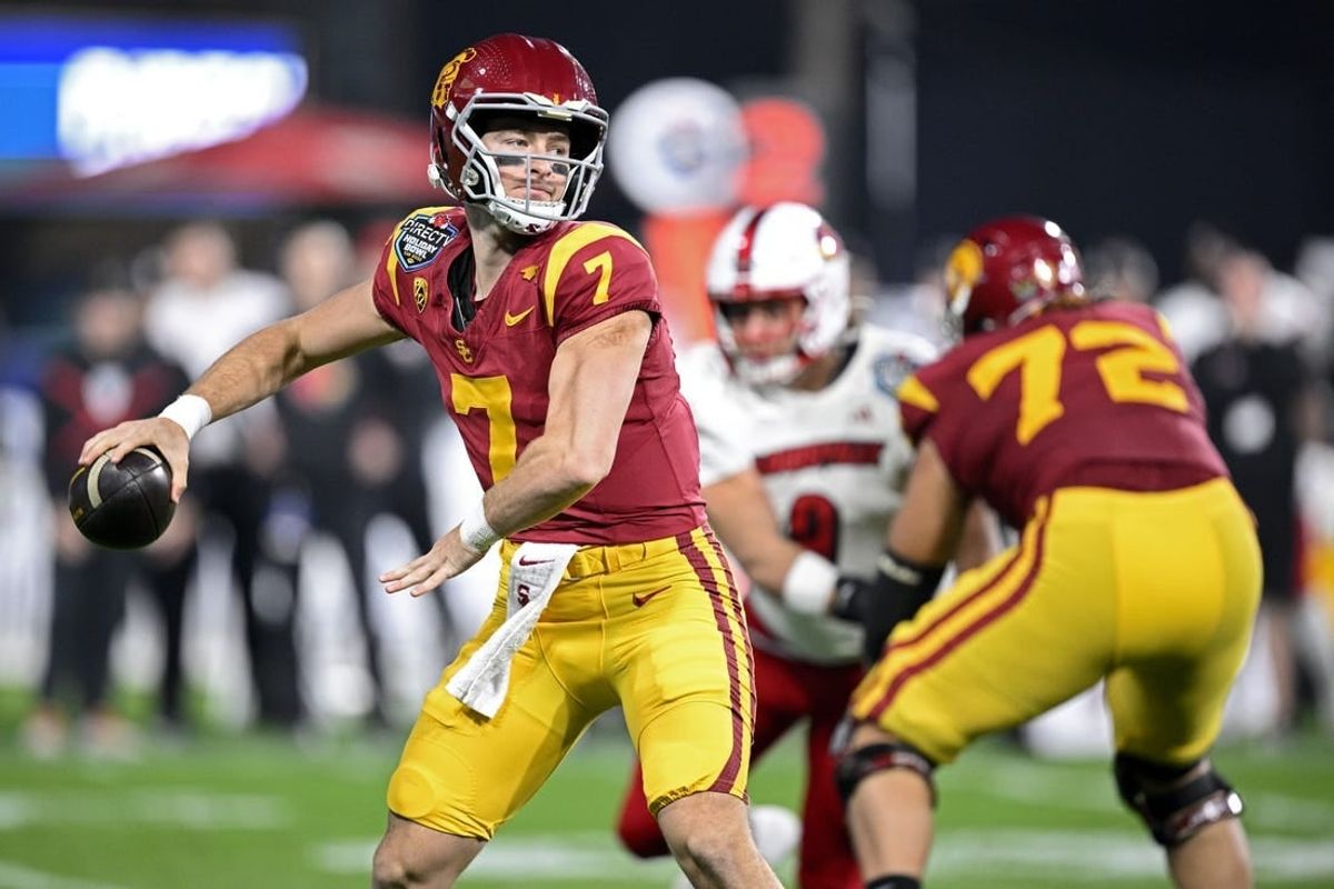 Dec 27, 2023; San Diego, CA, USA; USC Trojans quarterback Miller Moss (7) throws a pass against the Louisville Cardinals during the first half at Petco Park.