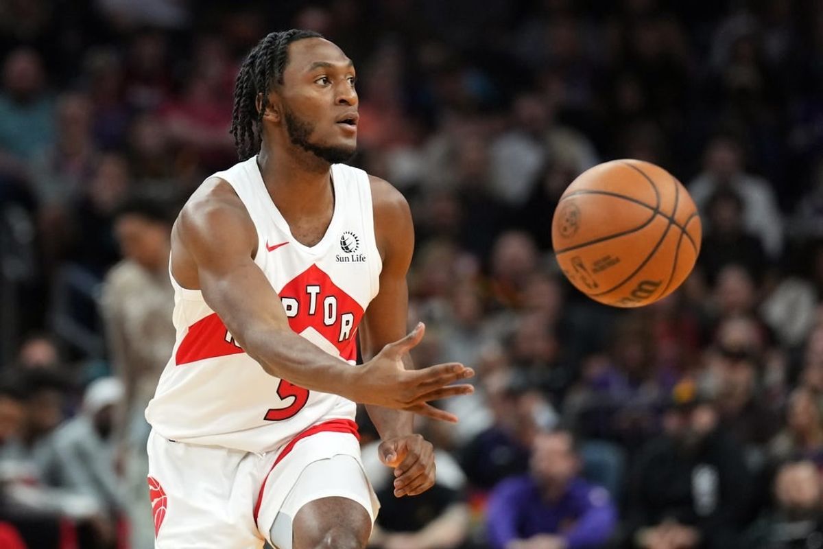 Mar 7, 2024; Phoenix, Arizona, USA; Toronto Raptors guard Immanuel Quickley (5) passes against the Phoenix Suns during the first half at Footprint Center.
