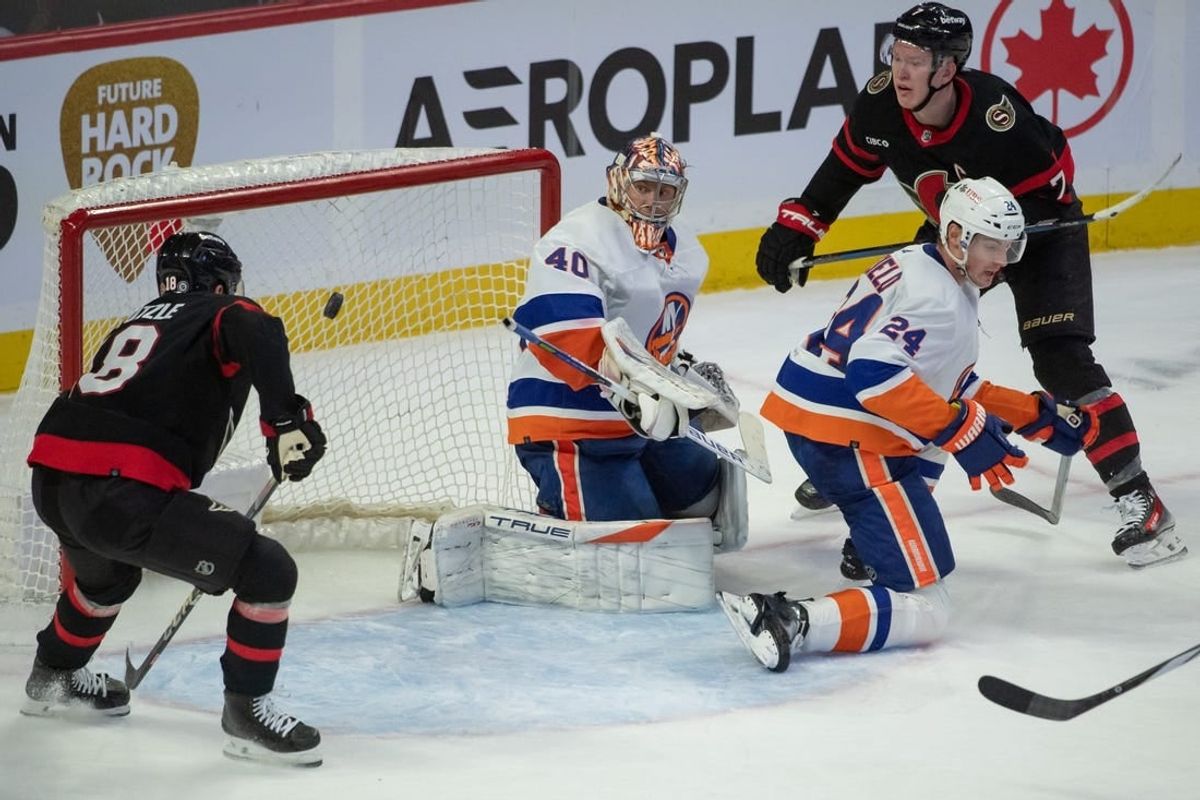 sNov 24 2023; Ottawa, Ontario, CAN; Ottawa Senators center Tim Stutzle (18) and left wing Brady Tkachuk (7) follow the puck as is travels behind New York Islanders goalie Semyon Varlamov (40) in the third period at the Canadian Tire Centre.