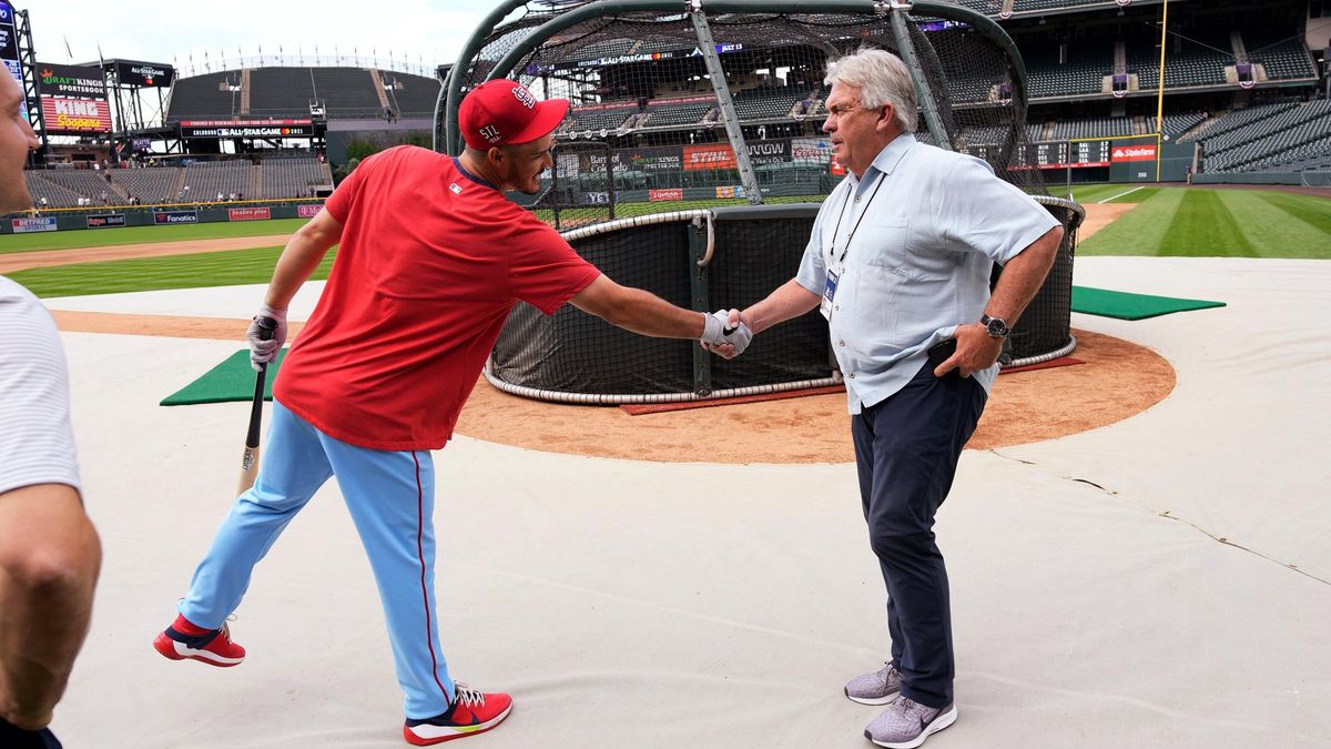 Nolan Arenado greets Bill Schmidt, the new Colorado GM.