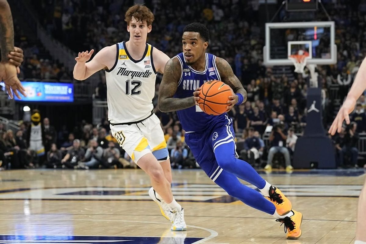 Jan 27, 2024; Milwaukee, Wisconsin, USA;  Seton Hall Pirates guard Al-Amir Dawes (2) drives for the basket in front of Marquette Golden Eagles forward Ben Gold (12) during the first half at Fiserv Forum.