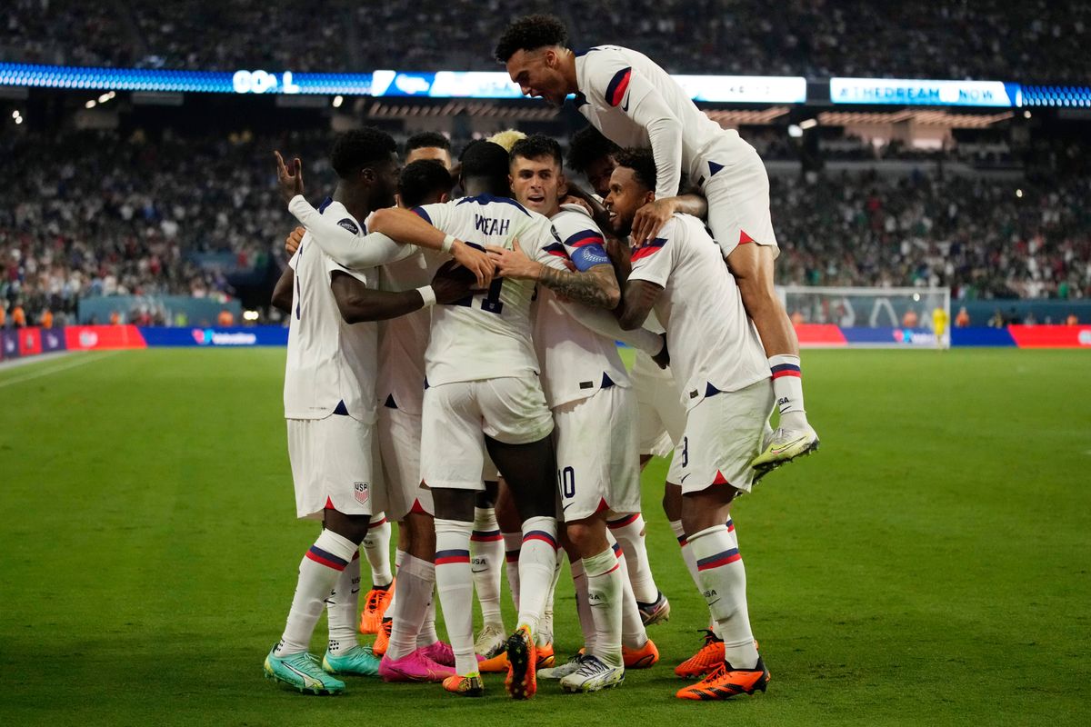 United States players celebrate a goal by Christian Pulisic against Mexico