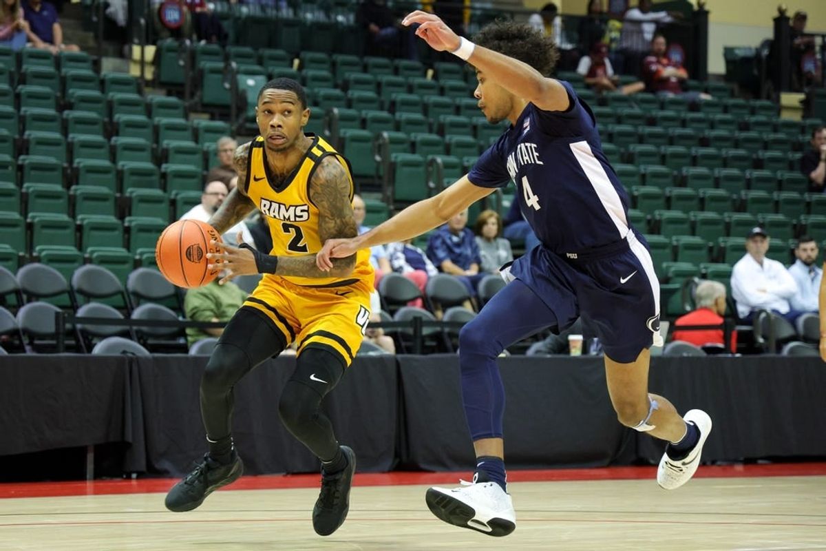 Nov 26, 2023; Kissimmee, FL, USA;  Virginia Commonwealth Rams guard Zeb Jackson (2) drives to the basket past Penn State Nittany Lions forward Puff Johnson (4) in the first half during the ESPN Invitational Events tournament seventh place game at State Farm Field House.