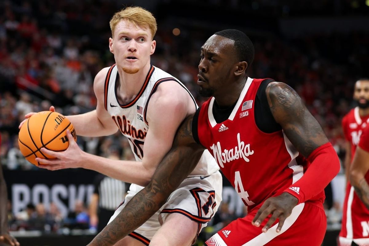 Mar 16, 2024; Minneapolis, MN, USA; Illinois Fighting Illini guard Luke Goode (10) controls the ball as Nebraska Cornhuskers forward Juwan Gary (4) defends during the first half at Target Center.
