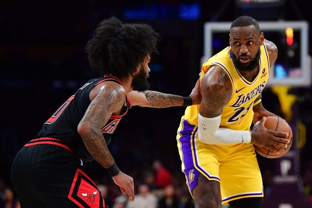 Jan 25, 2024; Los Angeles, California, USA; Los Angeles Lakers forward LeBron James (23) controls the ball against Chicago Bulls guard Coby White (0) during the first half at Crypto.com Arena.