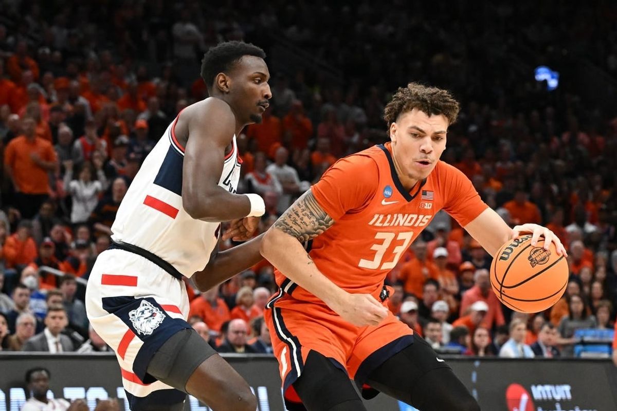 Mar 30, 2024; Boston, MA, USA; Illinois Fighting Illini forward Coleman Hawkins (33) dribbles the ball against the Connecticut Huskies in the finals of the East Regional of the 2024 NCAA Tournament at TD Garden.