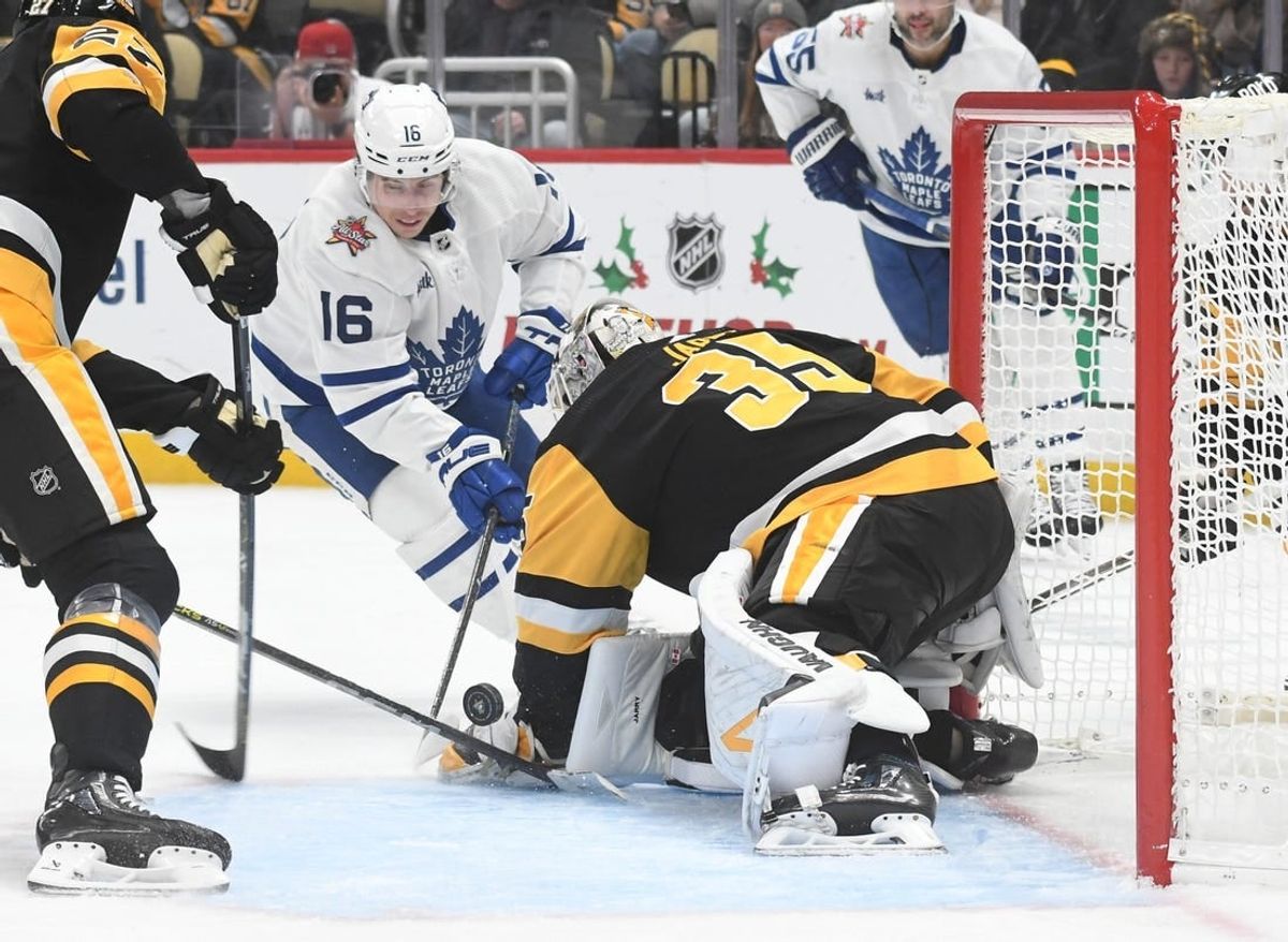 Nov 25, 2023; Pittsburgh, Pennsylvania, USA; Pittsburgh Penguins goalie Tristan Jarry (35) stops Toronto Maple Leafs right wing Mitchell Marner (16) during the second period at PPG Paints Arena.