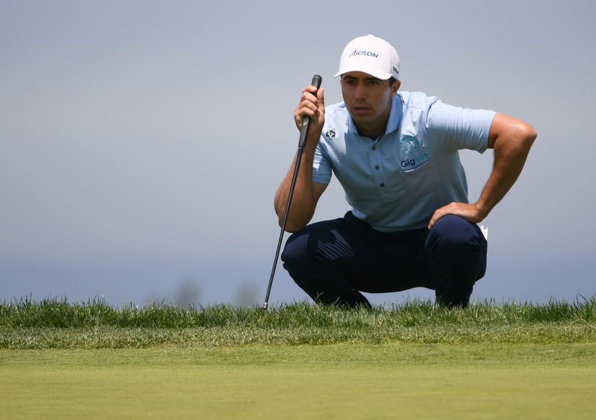Jun 17, 2021; San Diego, California, USA; Alvaro Ortiz lines up a putt on the 14th green during the first round of the U.S. Open golf tournament at Torrey Pines Golf Course.