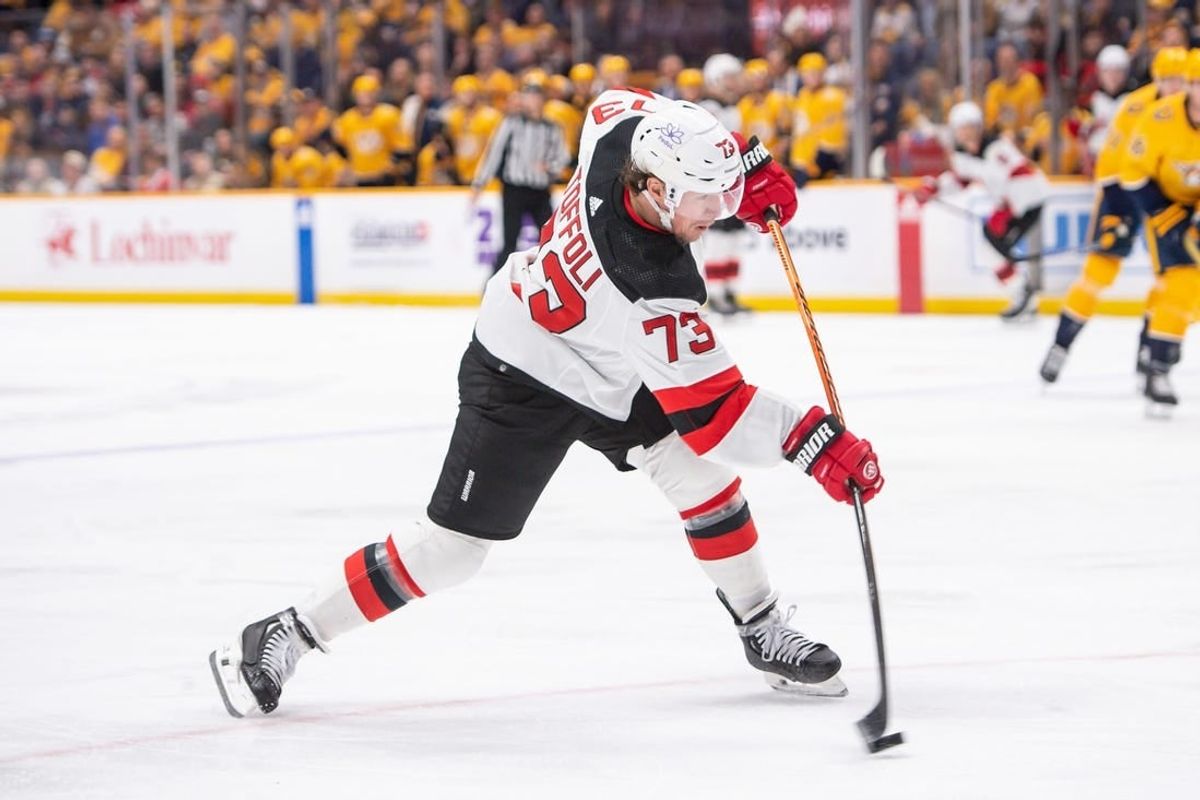 Feb 13, 2024; Nashville, Tennessee, USA;  New Jersey Devils right wing Tyler Toffoli (73) takes a shot on goal against the Nashville Predators during the second period at Bridgestone Arena.