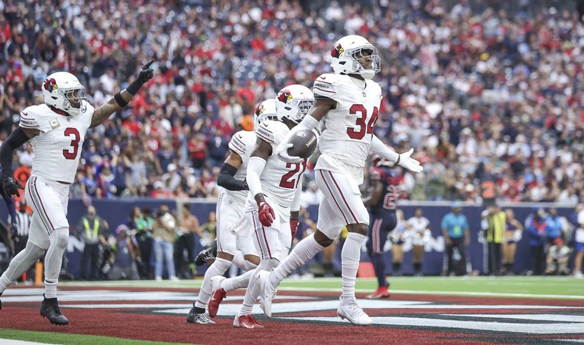 Nov 19, 2023; Houston, Texas, USA; Arizona Cardinals safety Jalen Thompson (34) reacts after making an interception during the second quarter against the Houston Texans at NRG Stadium.