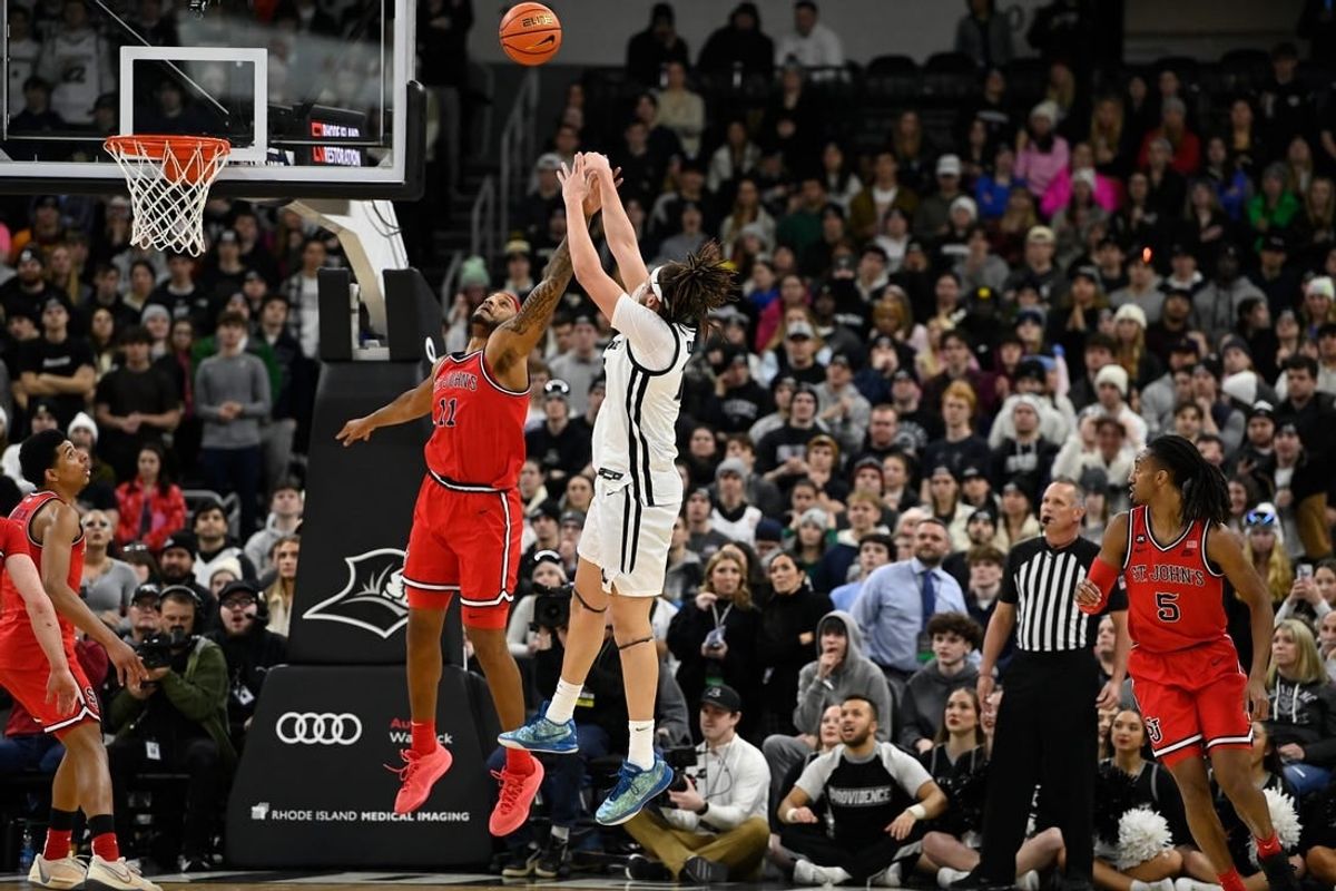 Feb 13, 2024; Providence, Rhode Island, USA; St. John's Red Storm center Joel Soriano (11) defends against Providence Friars forward Josh Oduro (13) during the second half at Amica Mutual Pavilion.