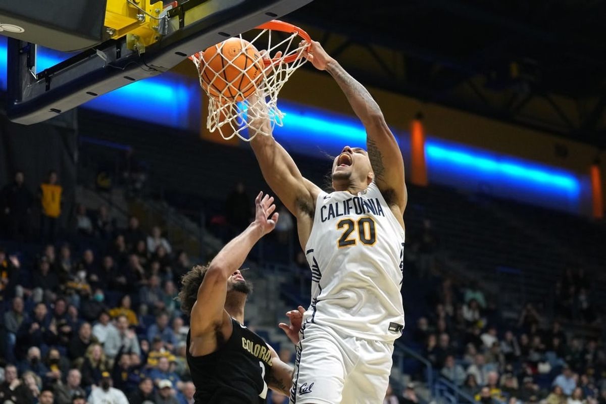 Jan 10, 2024; Berkeley, California, USA; California Golden Bears guard Jaylon Tyson (20) dunks against Colorado Buffaloes guard J'Vonne Hadley (1) during the second half at Haas Pavilion.
