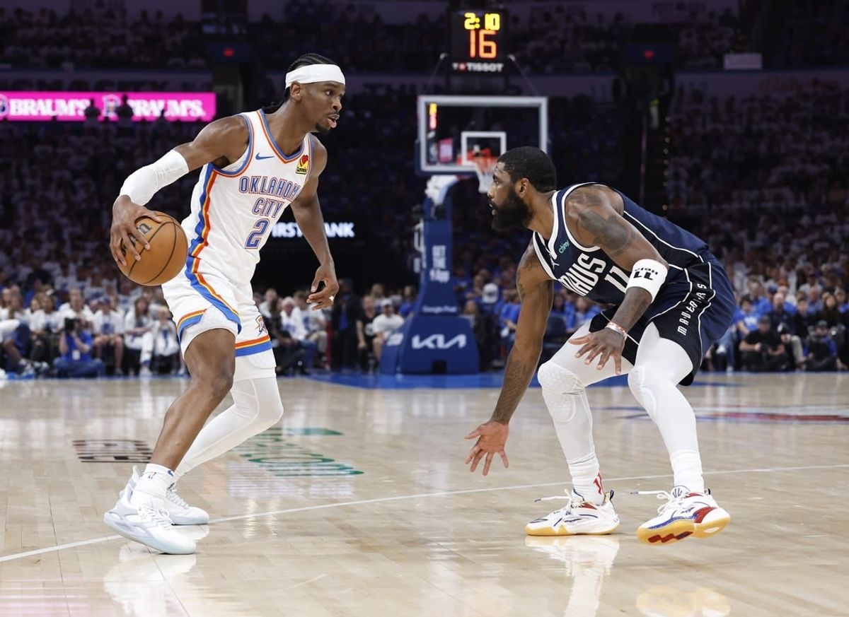 May 7, 2024; Oklahoma City, Oklahoma, USA; Oklahoma City Thunder guard Shai Gilgeous-Alexander (2) works his way to the basket against Dallas Mavericks guard Kyrie Irving (11) during the second quarter of game one of the second round for the 2024 NBA playoffs at Paycom Center.