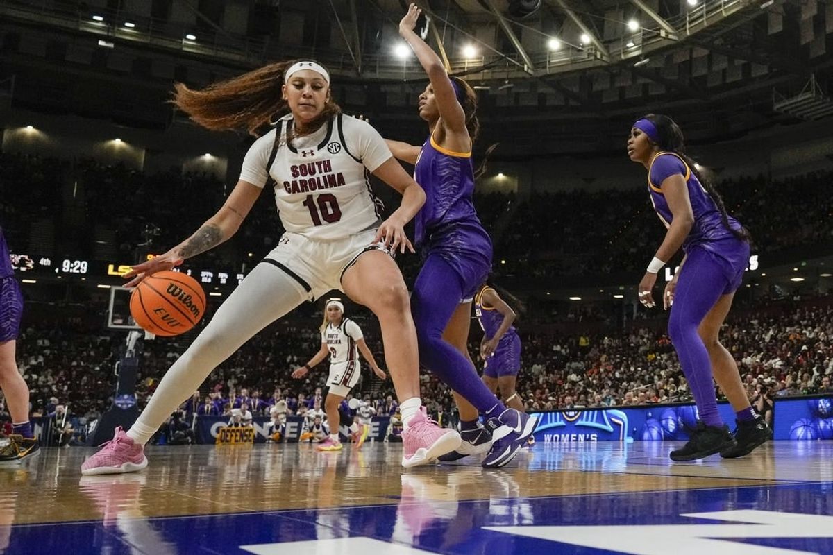 South Carolina Gamecocks center Kamilla Cardoso (10) works the ball toward the basket against LSU Lady Tigers forward Angel Reese (10) during the second half at Bon Secours Wellness Arena.
