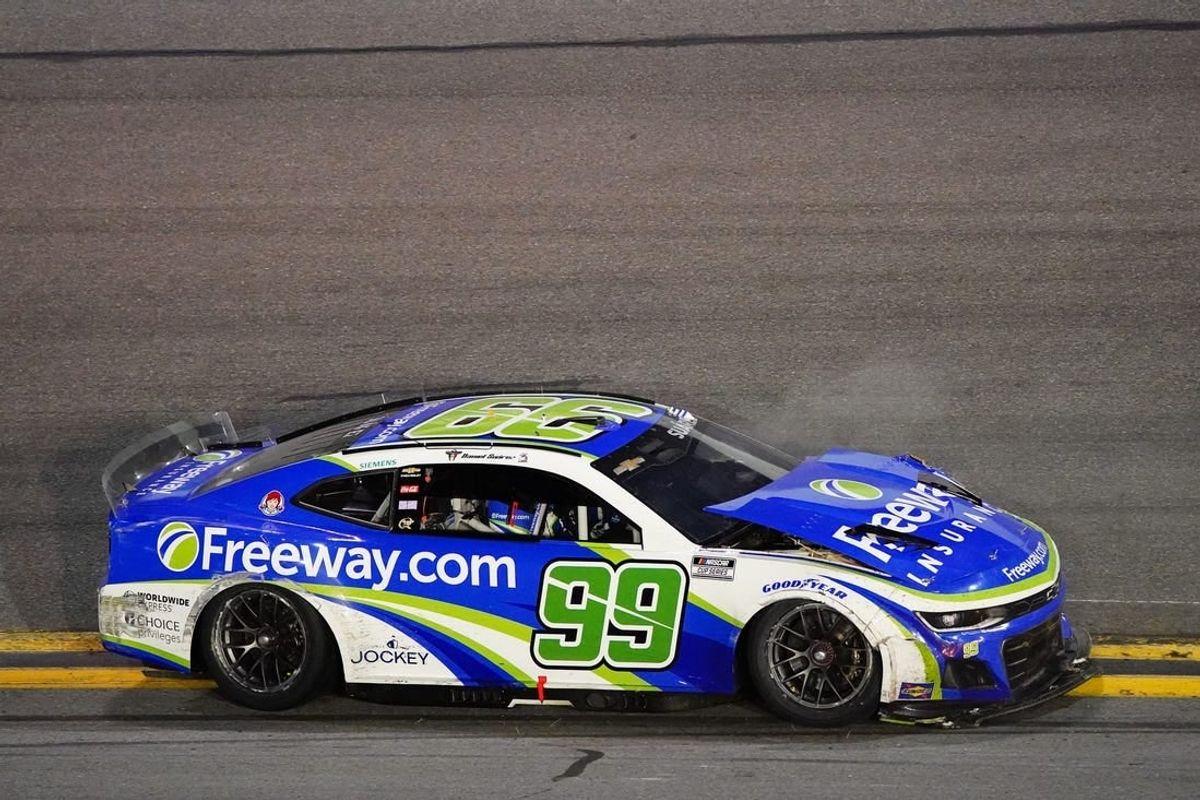 Feb 19, 2024; Daytona Beach, Florida, USA; NASCAR Cup Series driver Daniel Suarez (99) wrecks during the Daytona 500 at Daytona International Speedway.