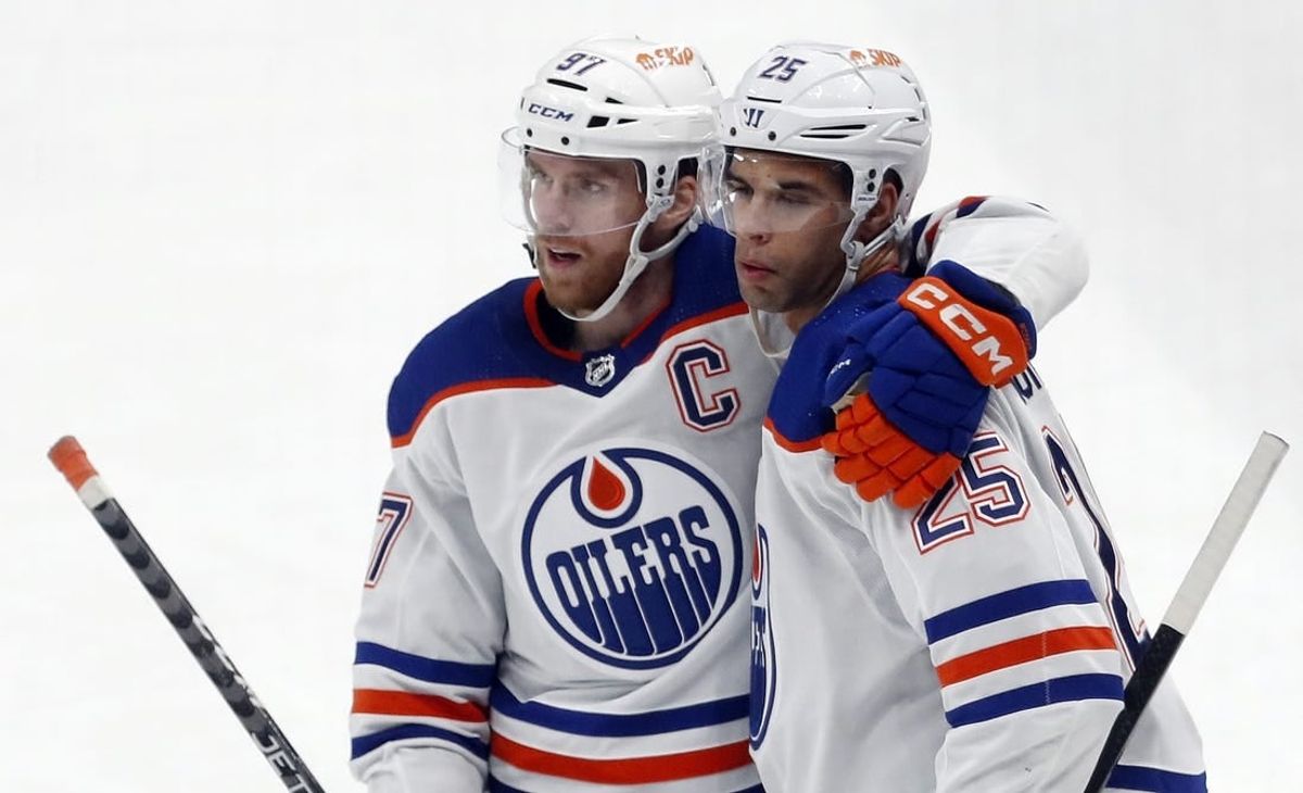Mar 10, 2024; Pittsburgh, Pennsylvania, USA;  Edmonton Oilers center Connor McDavid (left) congratulates  defenseman Darnell Nurse (25) after Nurse scored a goal against the Pittsburgh Penguins during the third period at PPG Paints Arena. The Oilers won 4-0.