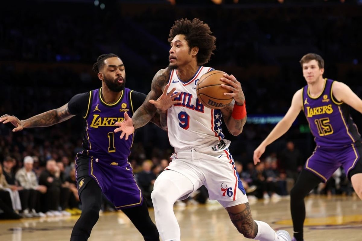 Mar 22, 2024; Los Angeles, California, USA;  Philadelphia 76ers guard Kelly Oubre Jr. (9) drives to the basket against Los Angeles Lakers guard D'Angelo Russell (1) during the first quarter at Crypto.com Arena.