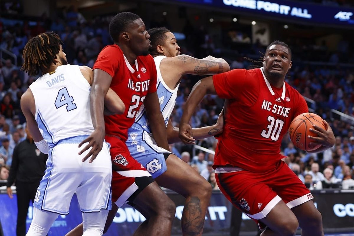 Mar 16, 2024; Washington, D.C., USA; North Carolina State Wolfpack forward DJ Burns Jr. (30) attempts to shoot the ball against the North Carolina Tar Heels during the second half at Capital One Arena.