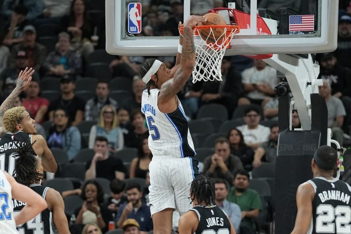 Jan 31, 2024; San Antonio, Texas, USA;  Orlando Magic forward Paolo Banchero (5) dunks in the first half against the San Antonio Spurs at Frost Bank Center.