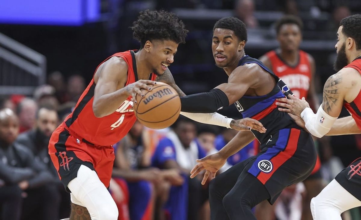 Jan 1, 2024; Houston, Texas, USA; Houston Rockets guard Jalen Green (4) controls the ball as Detroit Pistons guard Jaden Ivey (23) defends during the second quarter at Toyota Center.